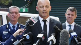 Gary Jubelin, flanked by onetime police commissioner Andrew Scipione (left) and former NSW Premier Mike Baird (right) announce $1m reward.
